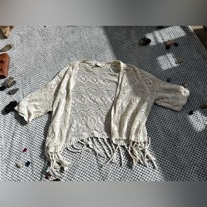 White knitted cardigan with fringe